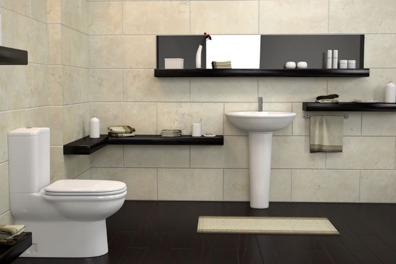 A bathroom with dark coloured floor