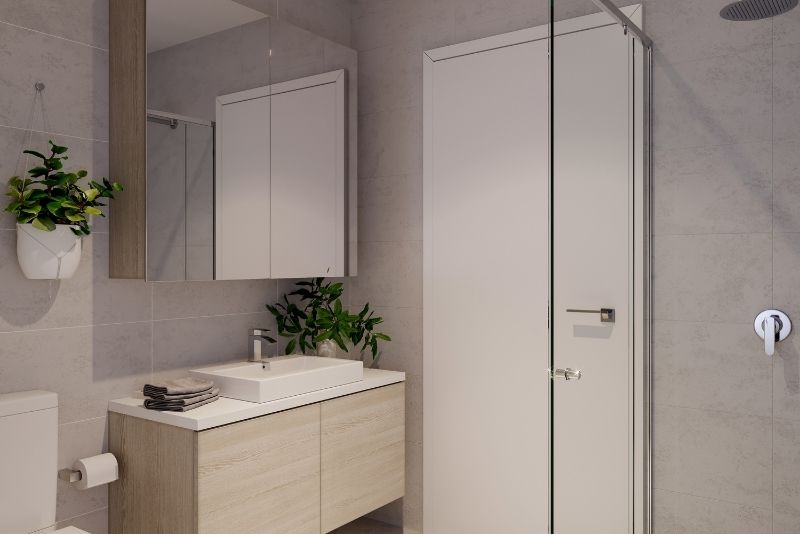 A simple bathroom with glass shower screen