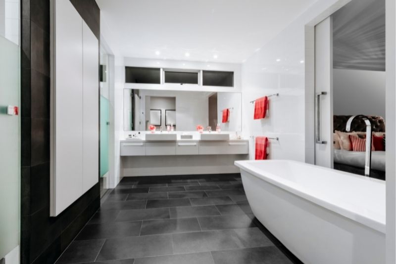 An ensuite bathroom with a bath tub